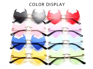 Detailed color display of various heart-shaped rimless devil sunglasses with metal frame