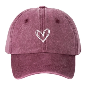 Unisex burgundy washed cotton baseball cap with white heart embroidery in a front view