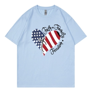 Detail of USA flag heart print and Faith Family Freedom text on light blue t-shirt