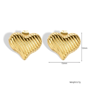 Detailed view of 18K gold plated heart earrings with vertical textures and dimensions