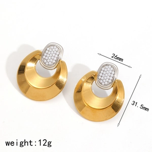 Golden crescent moon earrings with silver pearl studs and brushed metal texture
