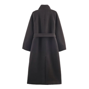 Rear view of long wool coat featuring raglan sleeves, waist tie, and back hem slit detail