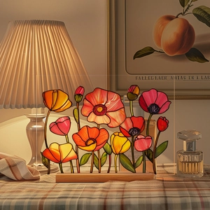 Detail of colorful acrylic floral plaque with vibrant poppies and a natural wood base