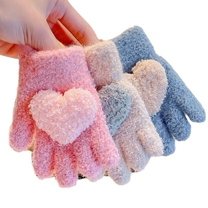 Plush knitted winter gloves for kids featuring cute heart patterns in multiple colors