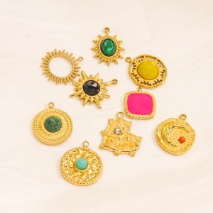 Golden titanium steel natural stone pendants in sun moon heart shapes on white satin