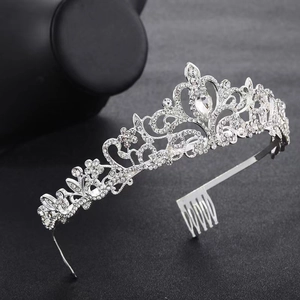 Detailed view of silver birthday tiara with rhinestones and built-in side hair combs