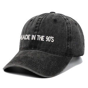 Detail of MADE IN THE 90'S white embroidery on charcoal washed cotton baseball cap
