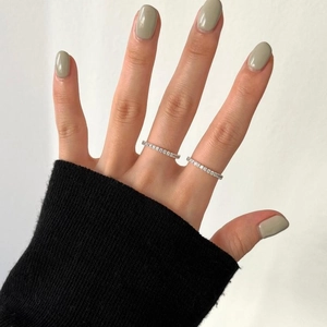 Detail of minimalist S925 sterling silver thin rings with sparkling zircon inlay