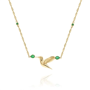 Detailed close-up of a hummingbird pendant in gold finish with green gemstones and silver chain