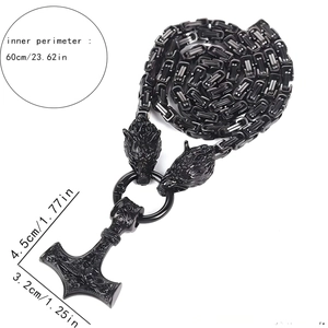 Detail of Viking Thor Hammer Mjolnir pendant with wolf heads on Franco Link chain