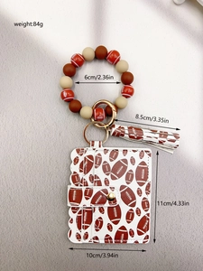Detailed view of rugby pattern PU leather card holder and silicone beaded keychain bracelet