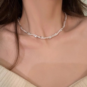 Elegant silver pearl fringe necklace with double twist design and sparkling diamond accents