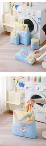 Detailed view of 3D mesh laundry bags with summer cartoon patterns and zipper closure