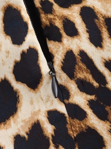 Macro shot of the black invisible zipper on a leopard print sleeveless A-line dress