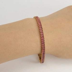 Elegant 18K gold plated tennis bracelet featuring rectangular pink cubic zirconia crystals