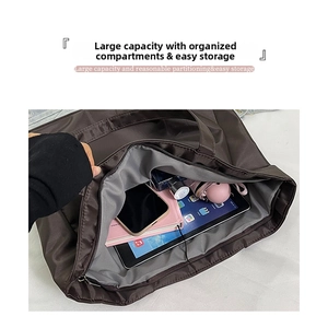 Macro view of large brown tote bag interior showing ample space and organized compartments