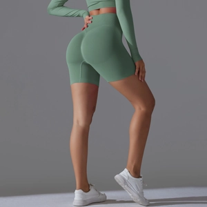 Detail view of high waist seamless yoga shorts in grass green with scrunch butt lifting effect
