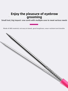 Detail of pink dual-ended eyebrow brush featuring metal grooming head and non-slip handle