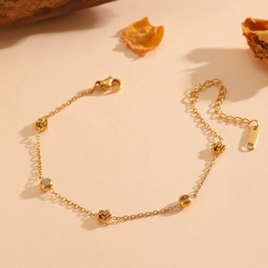 Elegant 18k gold plated stainless steel floral bracelet with pink and clear crystals
