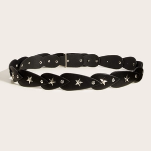 Vintage black leather belt with silver star studs and circular metal rings on beige background