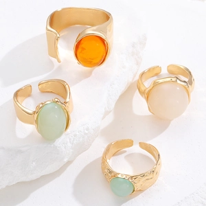 Stackable gold gemstone rings with vintage hammered texture and adjustable open bands