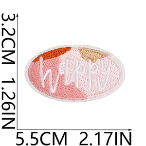Detailed view of pink happy embroidered patch with dimensions 5.5cm by 3.2cm shown clearly