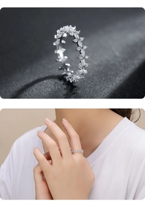 Detail of s925 silver ring with marquise and round cubic zirconia in petal design