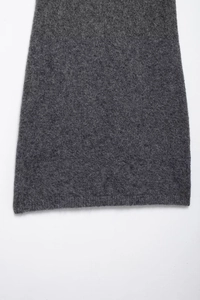 Detail showing high-quality dark grey knitted fabric texture and soft wool finish