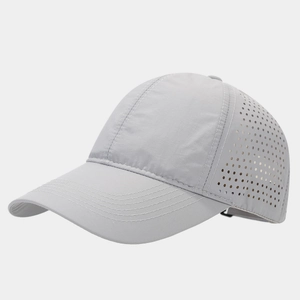 Detail view of light grey quick-dry baseball cap featuring laser-cut breathable side holes