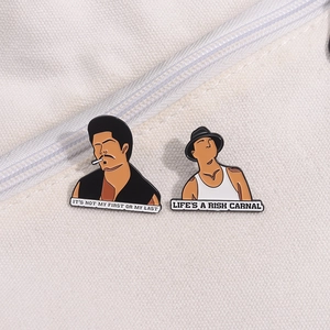 Detail of Blood In Blood Out enamel pins on a white canvas bag with movie quotes