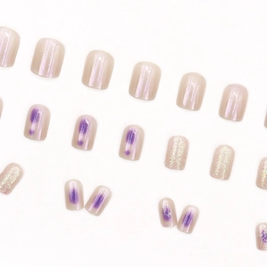 Translucent lilac aurora press-on nails set with champagne pearl and silver glitter finish