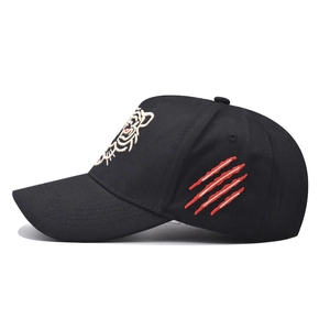 Black cotton baseball cap featuring detailed white tiger head and red claw marks embroidery