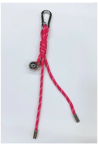 Close-up of pink woven paracord keychain with a silver metal bell and carabiner clip