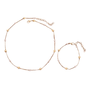 Golden heart charm and white pearl jewelry set featuring necklace and bracelet