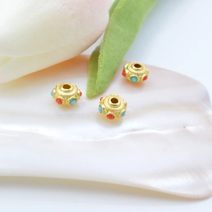 Golden retro DIY beads with red and blue enamel inlays on floral petals