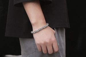 Detailed close-up of a silver Byzantine chain bracelet made of durable stainless steel