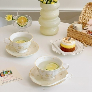 Detail of camellia ragdoll cat ceramic teacup set with floral spoon in French vintage style