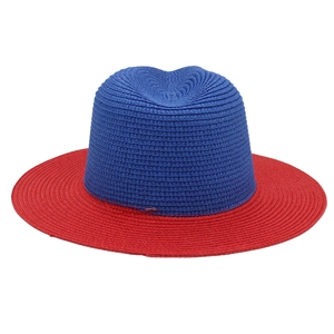 Detailed weave texture of two-tone red and blue straw panama hat with flat top crown