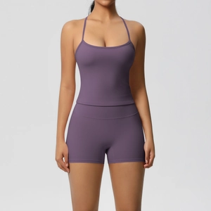 Detail of purple yoga set with thin strap backless top and high waist sports shorts