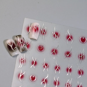 Chrome heart style nail art stickers with silver metallic lines and red heart designs