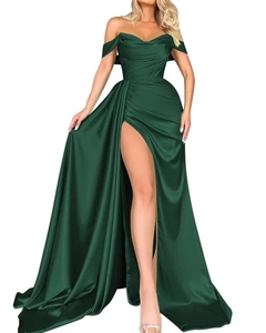 Detail of emerald green satin evening gown featuring off-shoulder sleeves and high slit design