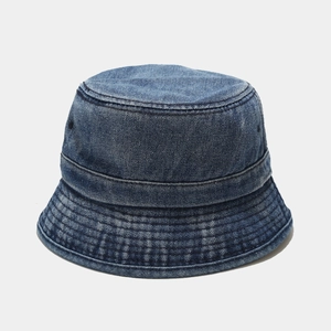 Close-up of washed blue denim bucket hat showing durable fabric texture and stitching detail