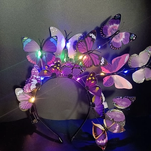 Detail of LED glowing butterfly headband with purple wings and colorful fiber optic lights