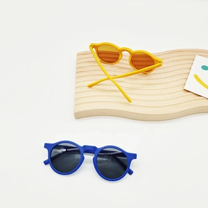Cute round frame kids sunglasses in yellow and blue colors with UV protection lens