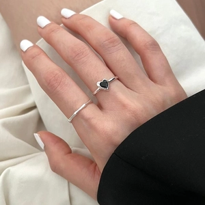 S925 sterling silver bamboo rings with a black heart stone shown on a hand model