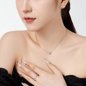 Exquisite S925 sterling silver jewelry set with pink heart zirconia on a female model