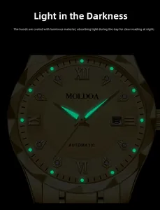 Luminous green glowing hands and markers on a gold luxury watch in a dark environment