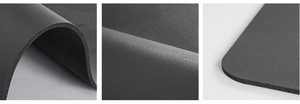 Macro shot of thick dark gray kitchen drying mat with leather texture and rounded edges