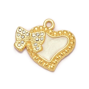 Detail of a gold heart pendant with a crystal-encrusted bow and white enamel inlay