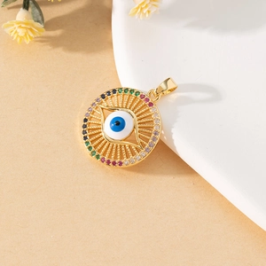 Close-up of a colorful evil eye charm pendant with inlaid stones on a neutral background
